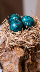 Dyed eggs in dark tidewater green tones. Easter festive background, open card, eggs close-up. Table setting for the Easter holiday. Christ is Risen Easter holiday.