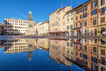 Rome, Italy - in Winter time, frequent rain showers create pools in which the wonderful Old Town of Rome reflect like in a mirror. Here in particular Campo de Fiori
