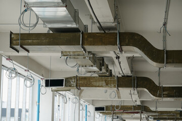 Installation of cold air ducts, air conditioning systems in buildings, priming and insulating inside.