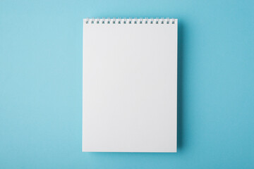 Above flat lay overhead close up view photo of clear open spiral notepad for letter document...