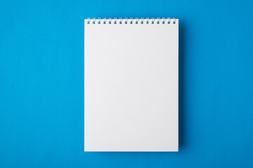 Above overhead close up flat lay view photo image of clear spiral notepad with space for text and design isolated bright color backdrop