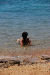 woman resting in water. Sharm El Sheikh, Egypt, Sınai
