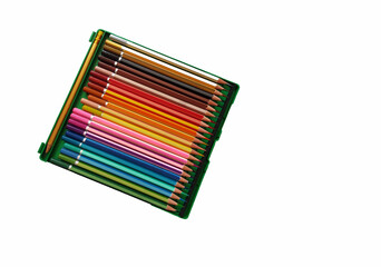 Colored pencils arranged in a row on a white background