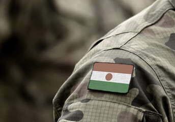 Flag of Niger on military uniforms Army, soldier, Africa. (collage).