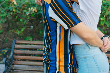 Romantic date. Love care relationship. Couple embracing in nature park.
