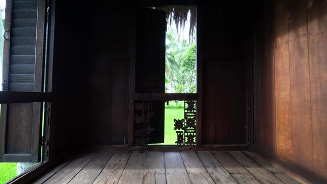 Walk the wooden Malays kampung house.