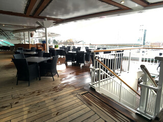 Outdoor sun and pool deck with loungers and deck chairs on modern luxury cruiseship or cruise ship...