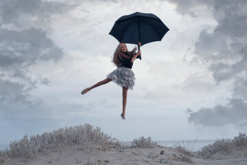 Girl floating with an umbrella