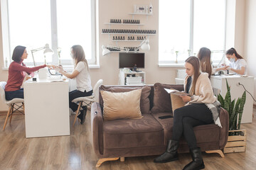 manicure in beauty salon. woman doing manicure