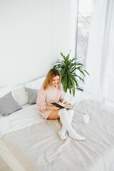 beautiful woman reading book in the bed. Relaxing concept