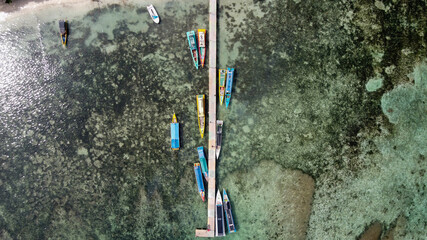 Aerial view of top down picture of colorful wooden boats. Boats at the pier. 