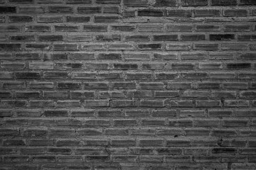 old brick wall background with black and white filter