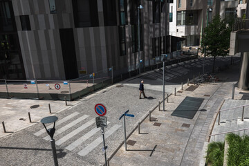 Man crossing empty streets