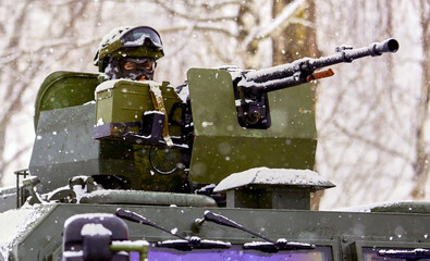 Warriors with weapons. A group of special forces soldiers in the winter forest.