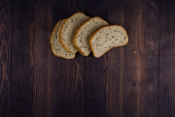 sliced bread on a dark wood table