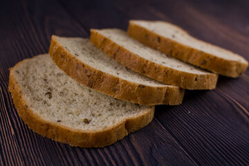 sliced bread on a dark wood table