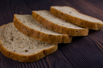 sliced bread on a dark wood table