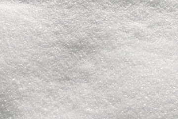 Snowflakes on clean snowy field in winter