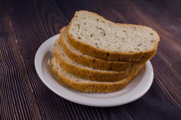 sliced bread on a dark wood table