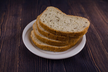 sliced bread on a dark wood table