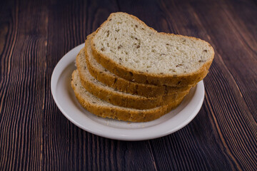 sliced bread on a dark wood table