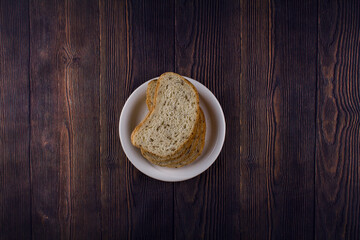 sliced bread on a dark wood table