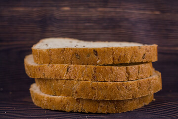 sliced bread on a dark wood table