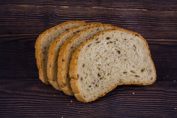 sliced bread on a dark wood table