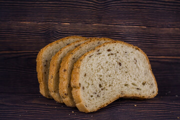 sliced bread on a dark wood table