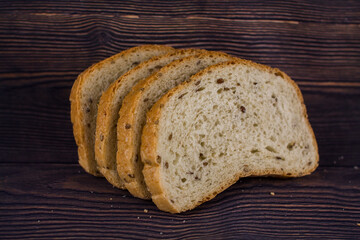 sliced bread on a dark wood table