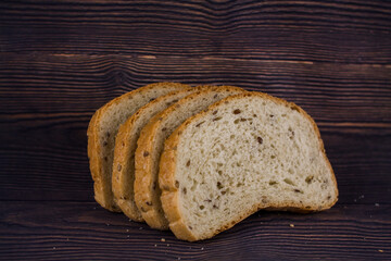sliced bread on a dark wood table