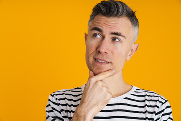 Thinking handsome man posing and looking aside