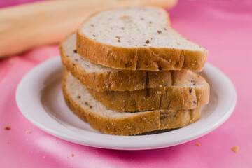 sliced bread with a rolling pin on the cloth
