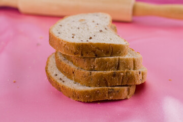 sliced bread with a rolling pin on the cloth