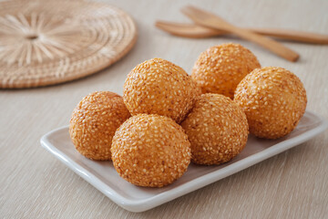 Sesame seed balls on white plate