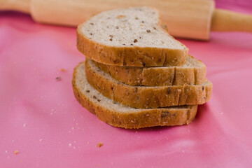 sliced bread with a rolling pin on the cloth