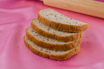 sliced bread with a rolling pin on the cloth