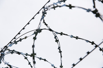 Barbed wire against the sky.
