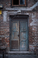 old wooden door in red brick building