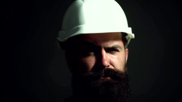 Worker in protection helmet. Repair man in hardhat, builder, engineer. Safety Construction Concept.