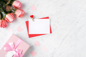 Valentine's Day design concept background with pink rose flower and gift box.