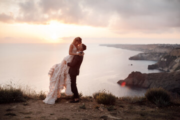 portrait of a happy bride in luxury dress and groom, wedding love emotions