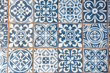 detail of a blue mosaic of a mosque