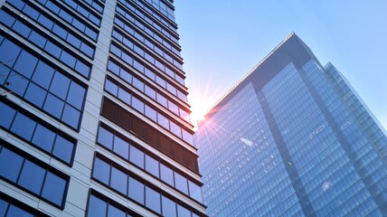 Concept for real estate and corporate construction..The modern office building of the orange morning sun in the sky background.