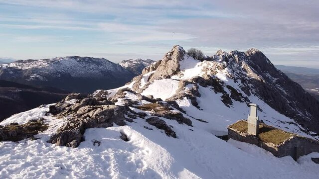 paragliders flying high over the mountains in winter (aerial video)