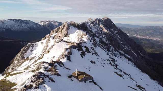 paragliders flying high over the mountains in winter (aerial video)