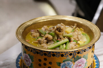 close up spicy frog in traditional Chinese pot. Chinese cuisine