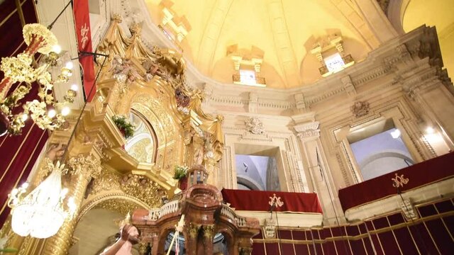 Interior of the Basilica of Santa Mar&iacute;a of Elche, Alicante. Antar with details in gold and religious relics. Main dome of the Cathedral of Elche, Alicante