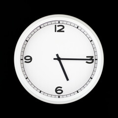 White round analog wall clock isolated on black background.