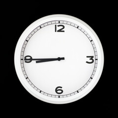 Fototapeta na wymiar White round analog wall clock isolated on black background.